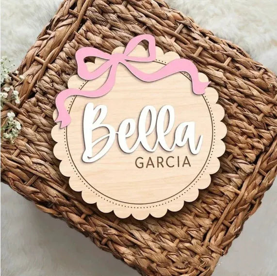 Square wooden baby ornament personalised with a custom name for nursery decor.