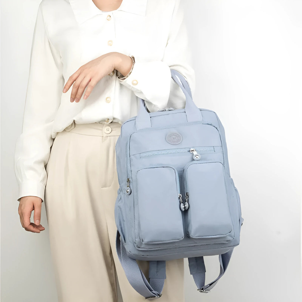 Women's waterproof nylon travel backpack showing internal organisation compartments and colour options