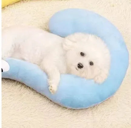Blue U-shaped cat neck protection pillow on pet bed