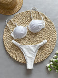 Women's underwire bikini swimsuit with split briefs in black colour showing European sizing