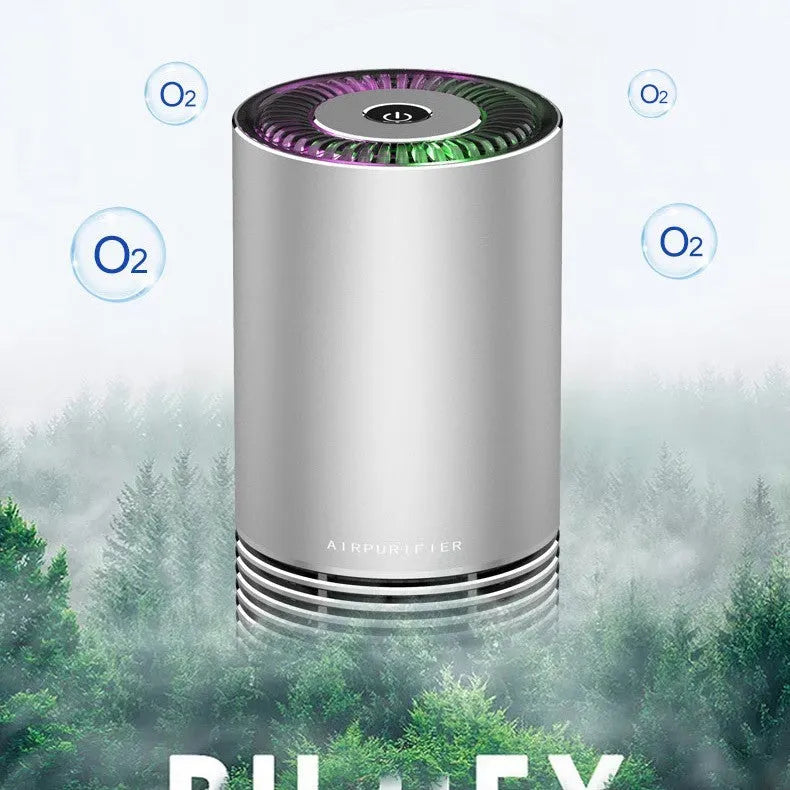 Compact black car air purifier with aluminium alloy body, shown with power cord.
