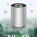 Compact black car air purifier with aluminium alloy body, shown with power cord.