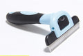 Removable ABS dog hair removal comb in blue or pink, available in small, medium and large.