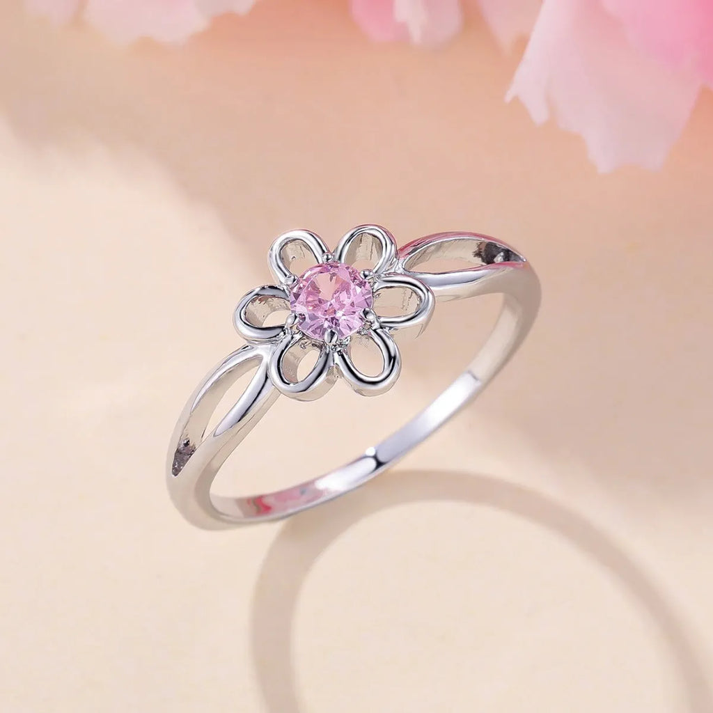 Close-up of a ladies floral hollow ring in electroplated copper with a platinum pink diamond finish.