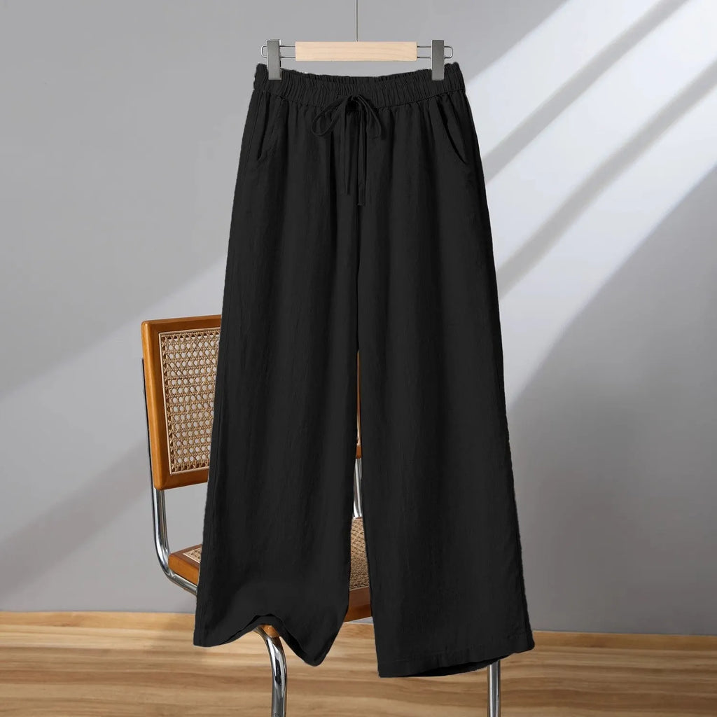 Women's straight-leg casual trousers with elastic waist and drawstring detail in polyester fabric
