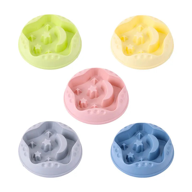 Blue plastic slow feeder dog bowl with moon, star, and wing-shaped interior ridges