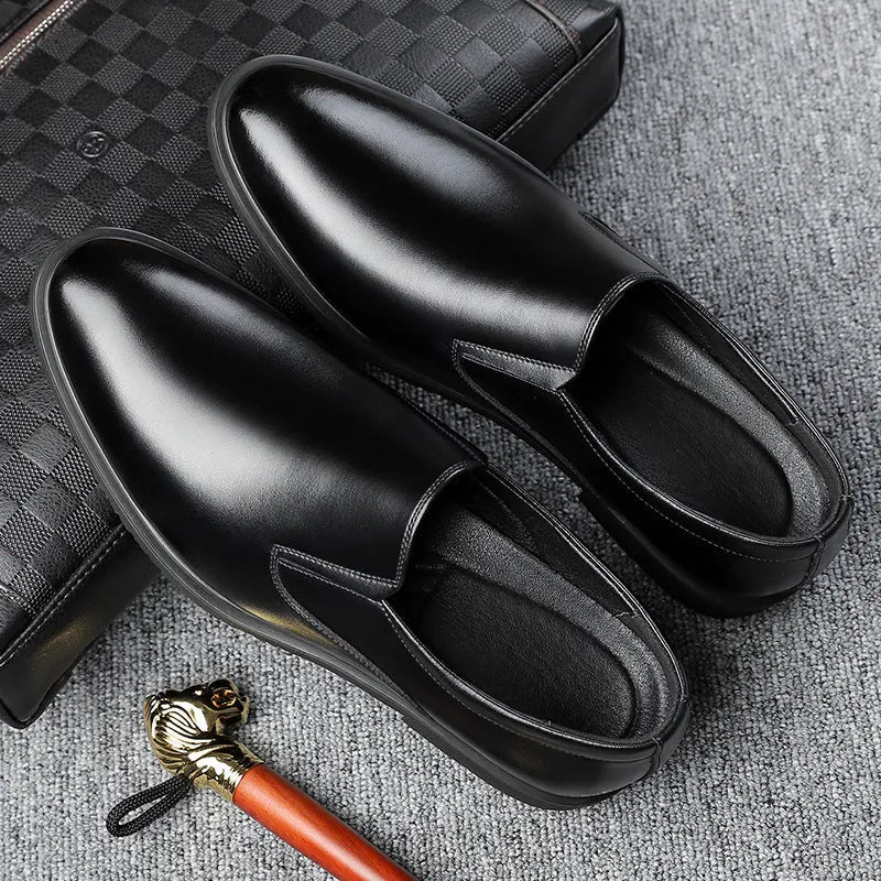 Men's black genuine leather slip-on loafers with a rubber sole and leather toe cap.