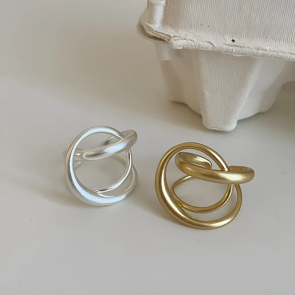 Women's matte metal open ring with three-dimensional interlaced geometric design in gold or silver finish