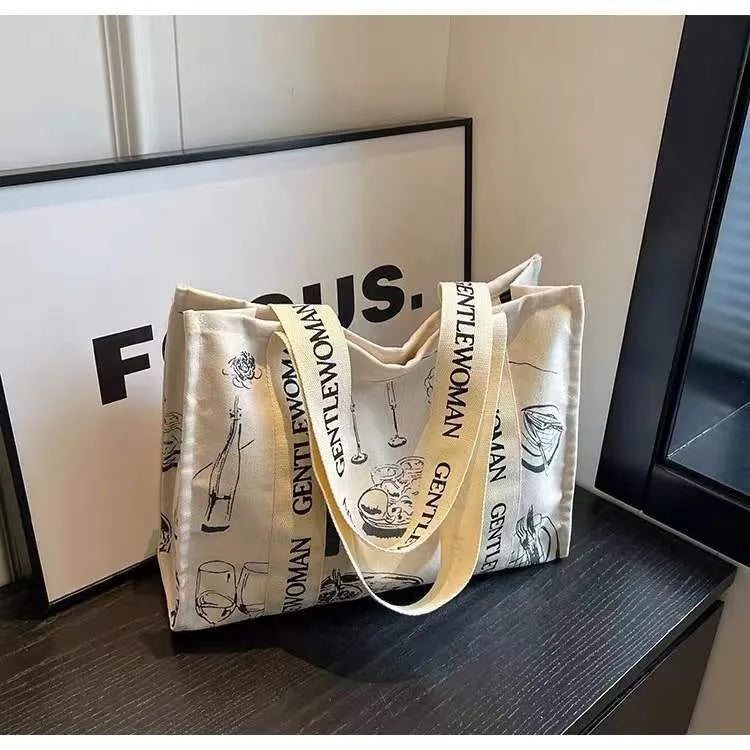 Canvas tote bag with printed design, large capacity for shopping and travel