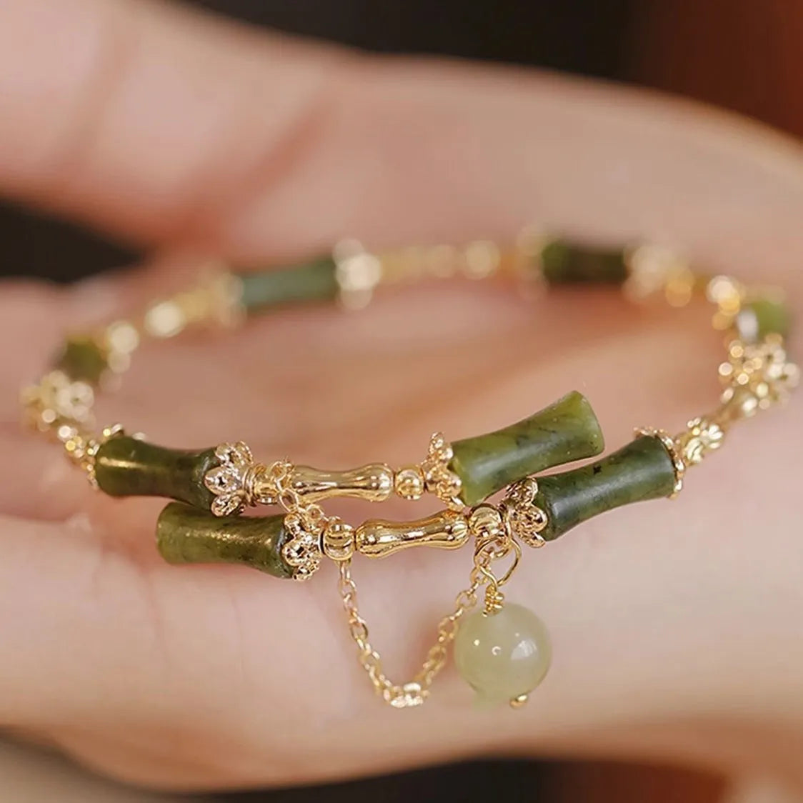 Women's bamboo bracelet with coloured glaze beads in plum wine colour featuring bamboo joint design