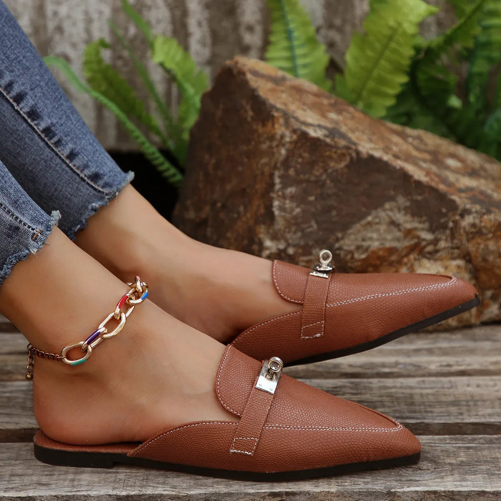 Light brown women's pointed toe low heel semi-slippers with a PU upper and rubber sole.