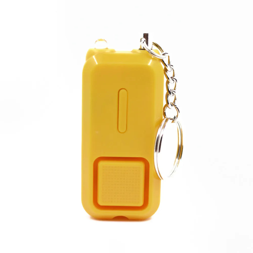 Compact pink personal safety alarm for women with keychain, shown next to its white box.