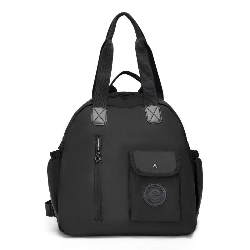 Women's large capacity lightweight nylon backpack in black with sandwich pocket compartments