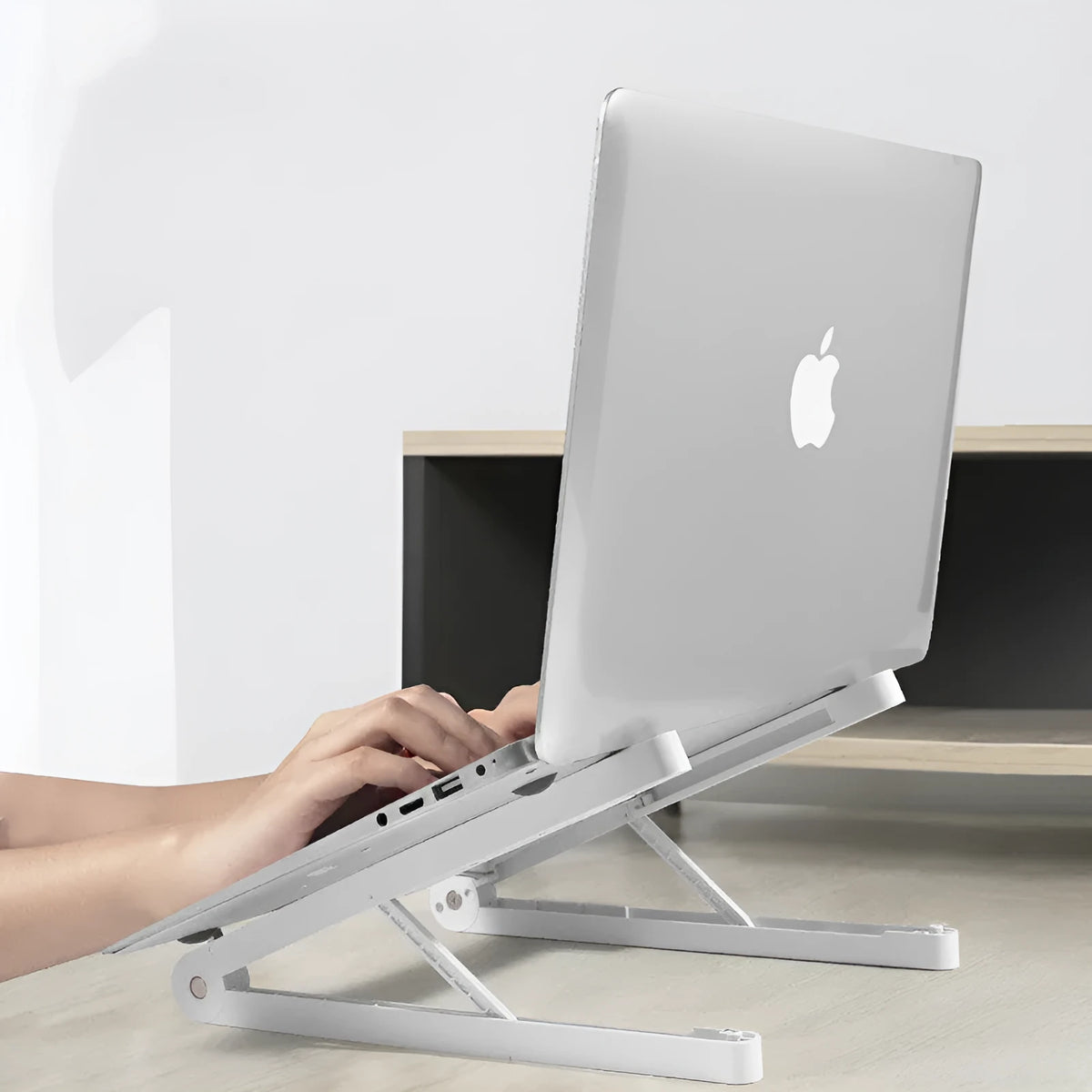 Folding ABS notebook stand in White or Black, 32 * 275MM, for desktop laptop use.