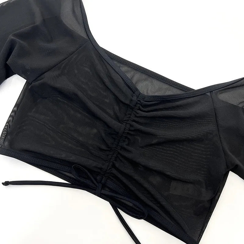 Black mesh four-piece women's swimsuit with long sleeves and briefs bottom