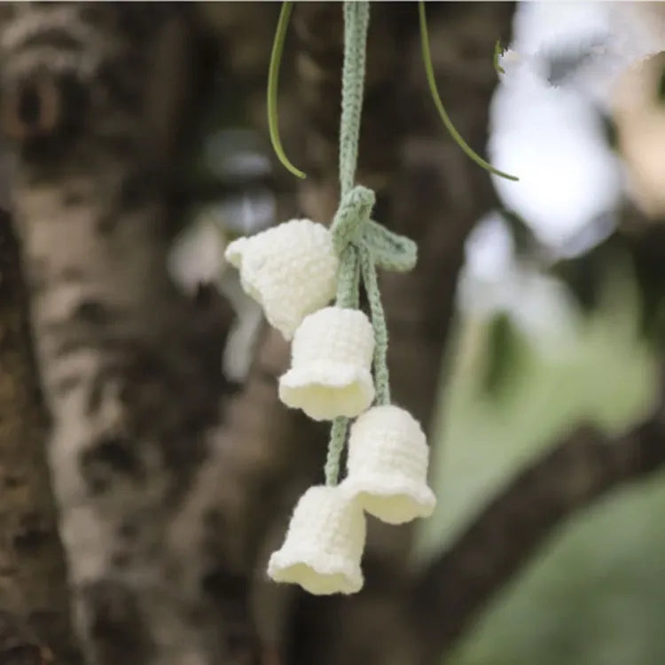 Green and white knitted wool car plant decoration with plastic base and hanging rope