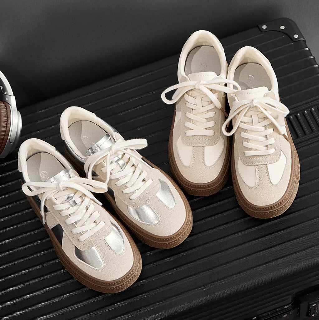 Retro milky white board shoes with cross shoulder straps and round toe on a rubber sole