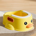 Blue PVC duck-shaped bathtub for washing dogs and cats on grass