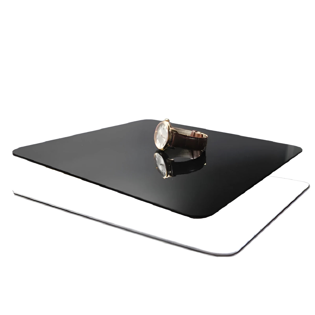 Square black and white acrylic reflection board for tabletop photography.