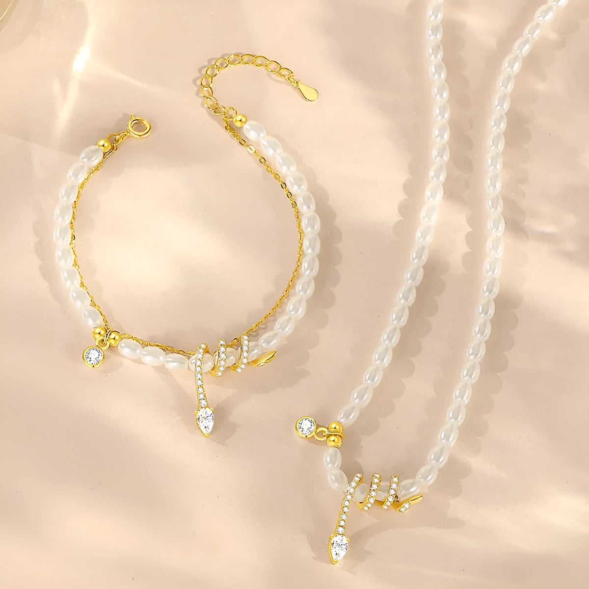 Pearl Snake 925 silver bracelet with snake charm, available in gold or white gold electroplated finish.