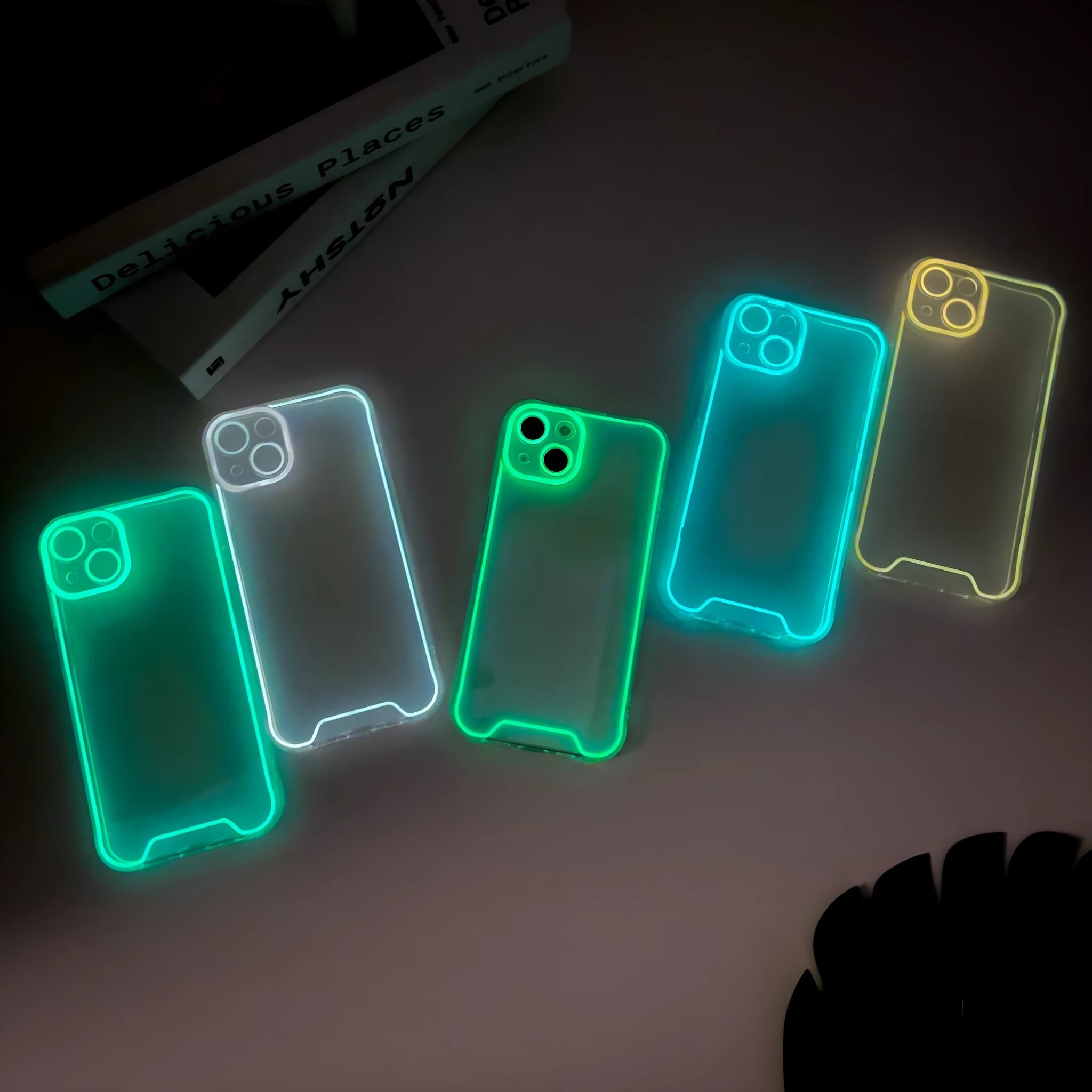 Glow in the dark green Christmas soft shell iPhone case on a table.
