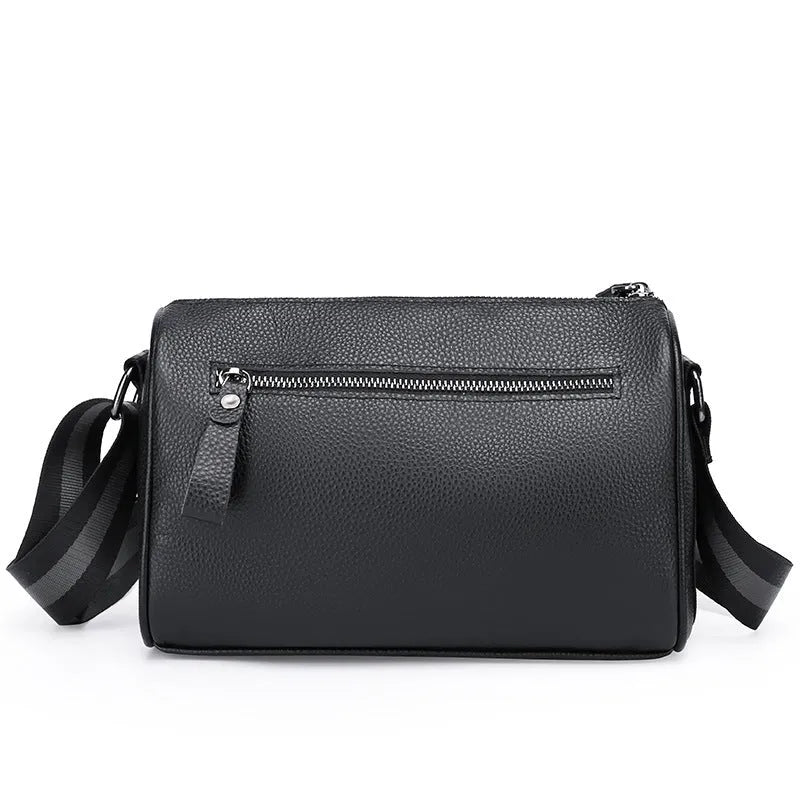 Black genuine leather one-shoulder crossbody bag showing front view and spacious interior.