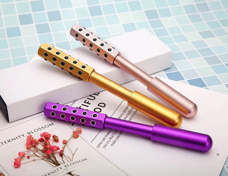 Germanium particles roller massage instrument in purple colour showing 24 rotating massage heads