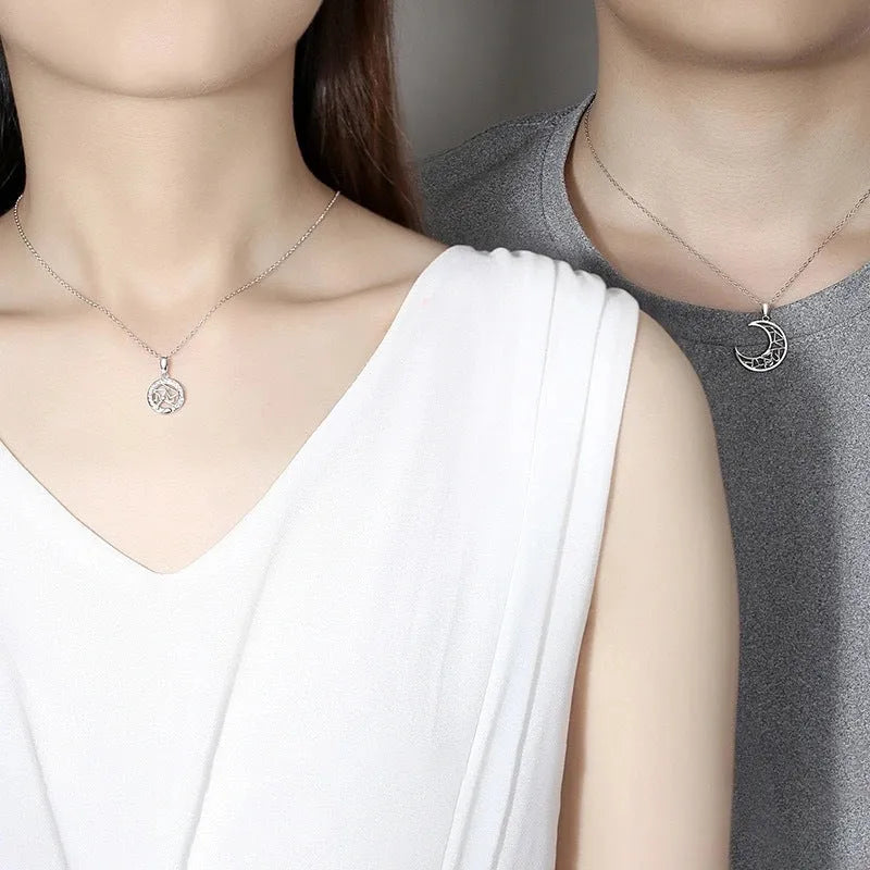 Sun Moon Tooth Couple Necklace showing electroplated copper pendant with cross chain