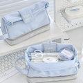 Folding double layer polyester pencil case in dark blue, blue, or cream white with compartment design for stationery organisation.