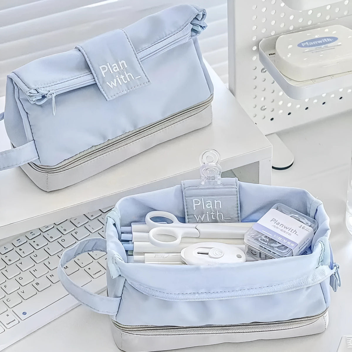 Folding double layer polyester pencil case in dark blue, blue, or cream white with compartment design for stationery organisation.