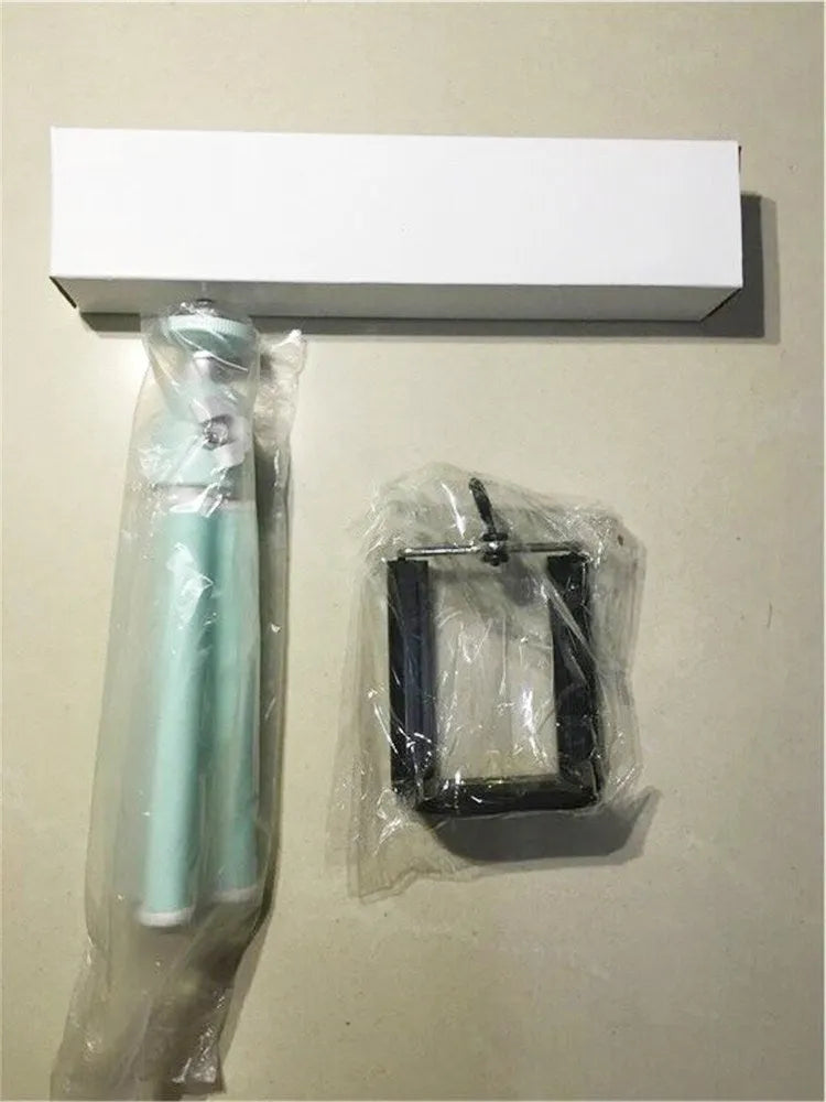 Black desktop phone holder with a two-section adjustable bracket arm holding a mobile phone.