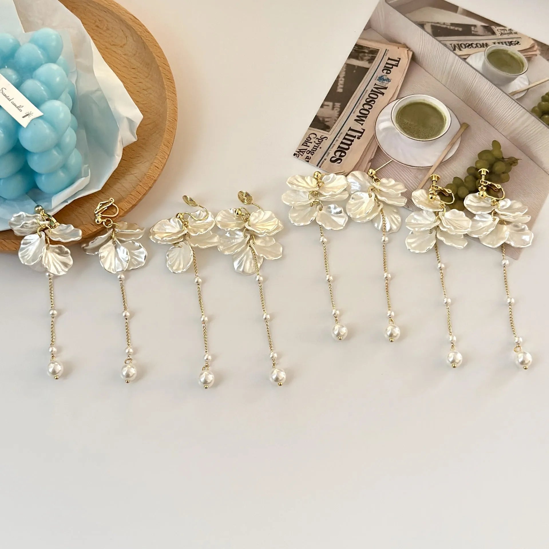 Women's shell-shaped pearl tassel earrings with four clip style options measuring 8.8cm long