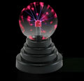 Coloured glass magic ball light on a white ABS base with a USB cable.