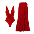 Red V-neck one-piece swimsuit with open back and matching long skirt for women.