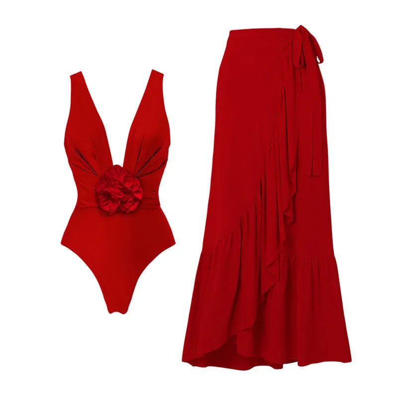 Red V-neck one-piece swimsuit with open back and matching long skirt for women.