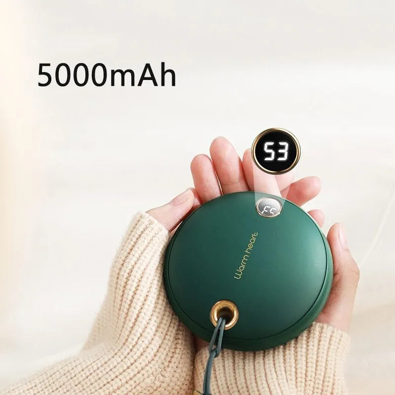 Green hand warmer power bank showing digital display with 5000mAh capacity