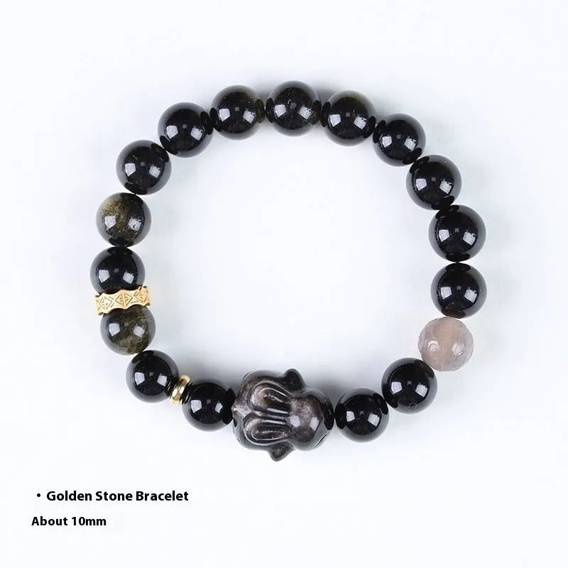 Handmade grey agate and silver lying rabbit charm bracelet on wrist, showing 10mm bead size option.