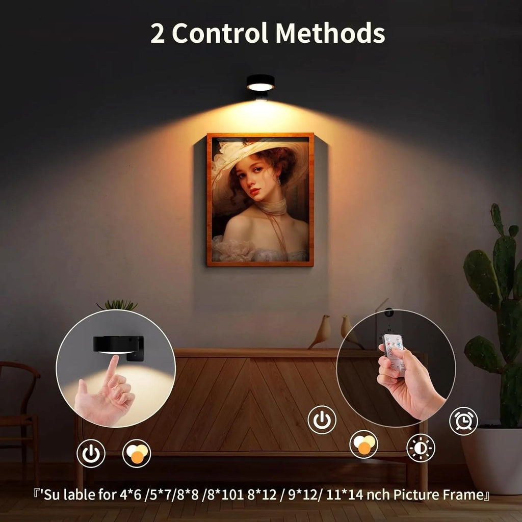 Black remote control LED magnetic picture light mounted above a painting, showing wireless power supply.
