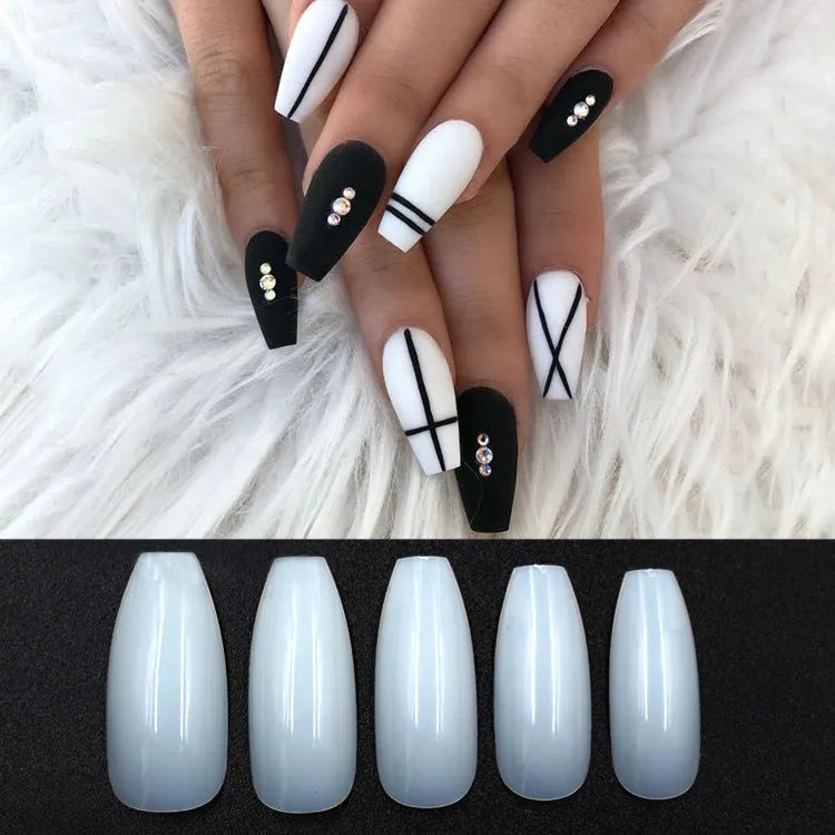500 clear and natural coloured ABS plastic false nails in ten different sizes arranged on a white surface