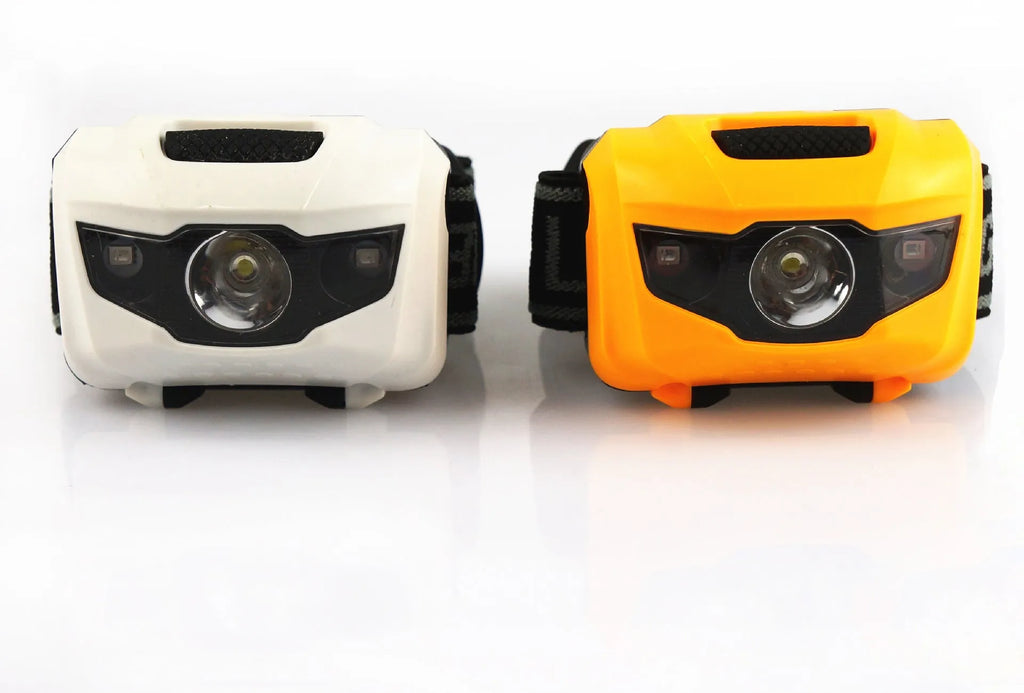 Black outdoor LED headlamp with white and red lights on an adjustable headband.