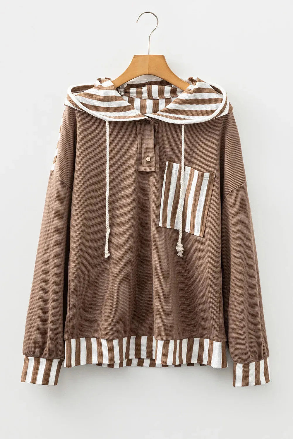 Straw yellow waffle texture hoodie with striped patchwork design, button neck, and drawstring hood.