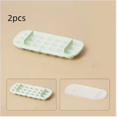 Yellow high-capacity plastic ice cube tray with leverage design and integrated shovel storage slot