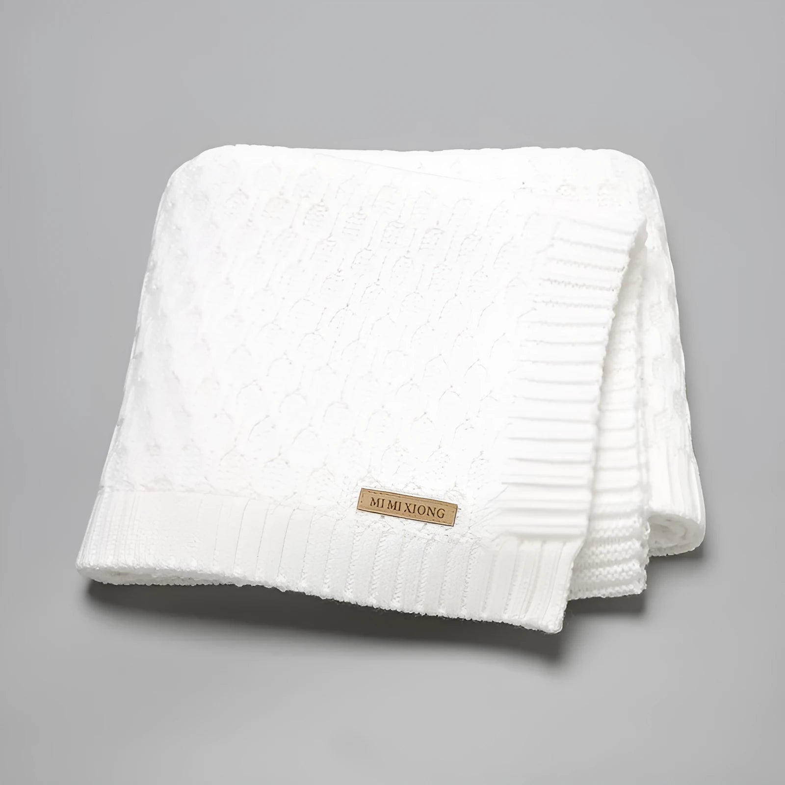 Acrylic infant hug blanket with three-dimensional lines measuring 70×90cm in solid colour options