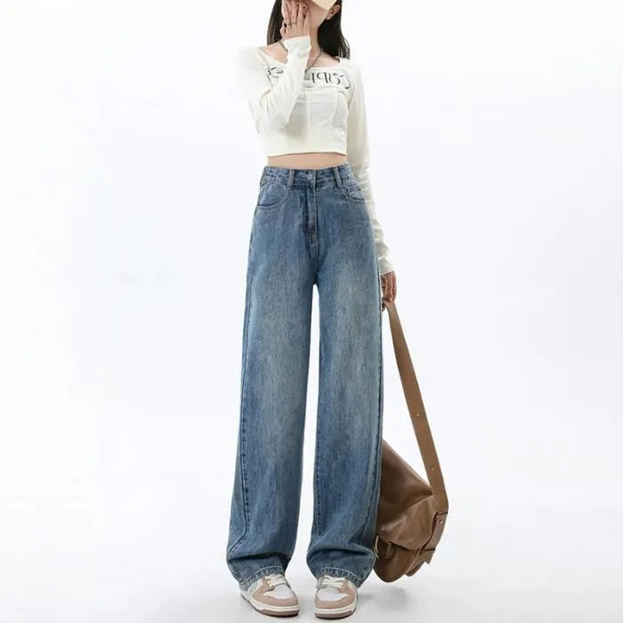 Woman wearing retro blue high waist wide leg jeans with a straight leg cut.