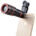 12X magnification phone telescope with adjustable clip attached to a mobile phone for long-distance photography.