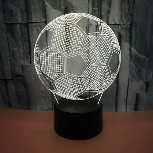 3D football-shaped acrylic night light displaying blue LED colour on a black ABS base.