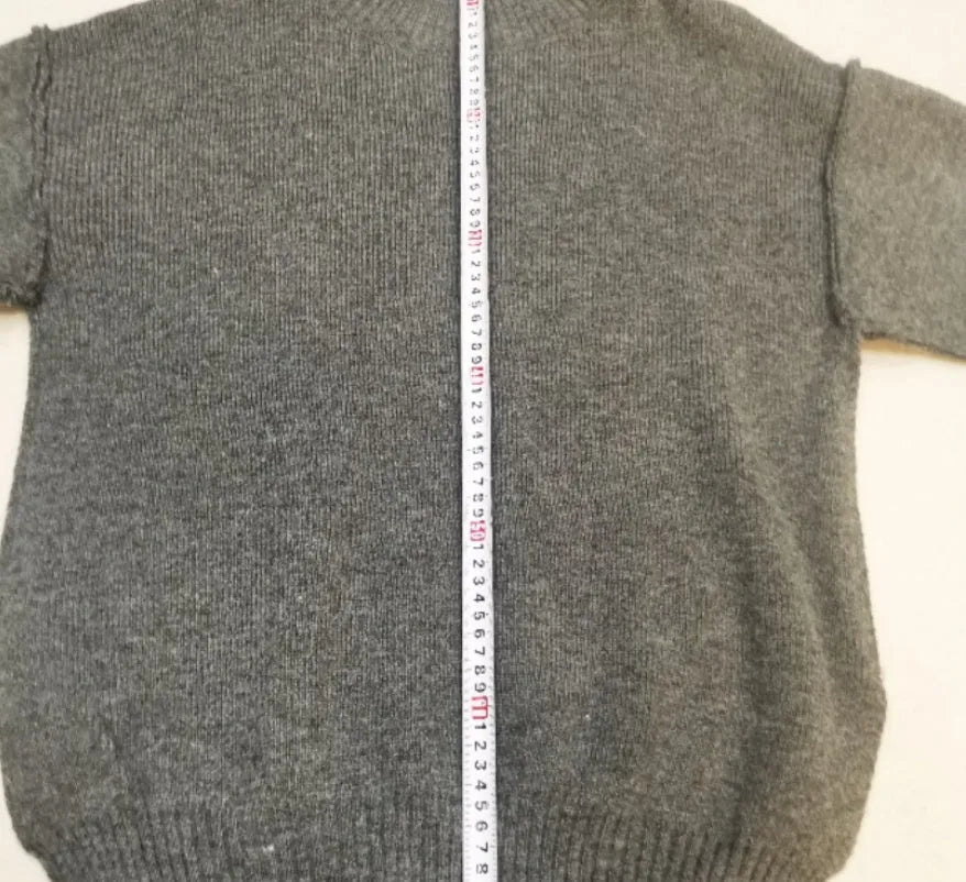 Women's dark grey side-slit sweater with matching trousers two-piece suit on hanger