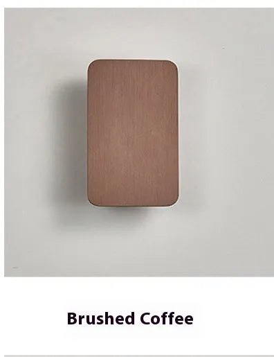 Minimalist modern wall lamp with a slim metal frame in a choice of four finishes, mounted on a wall.