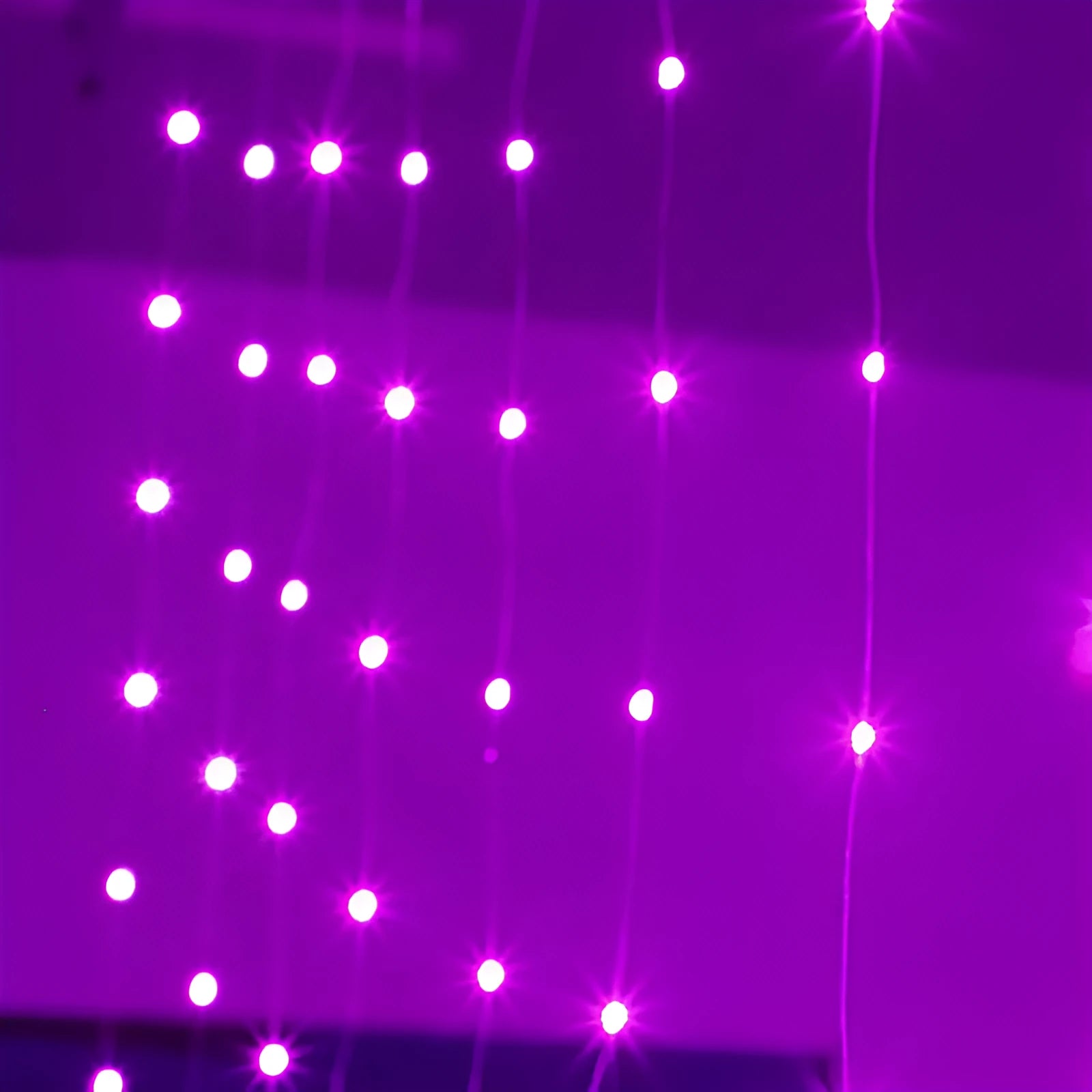 Copper curtain Christmas lights with LED beads in blue colour, showing romantic star lights effect for holiday decoration