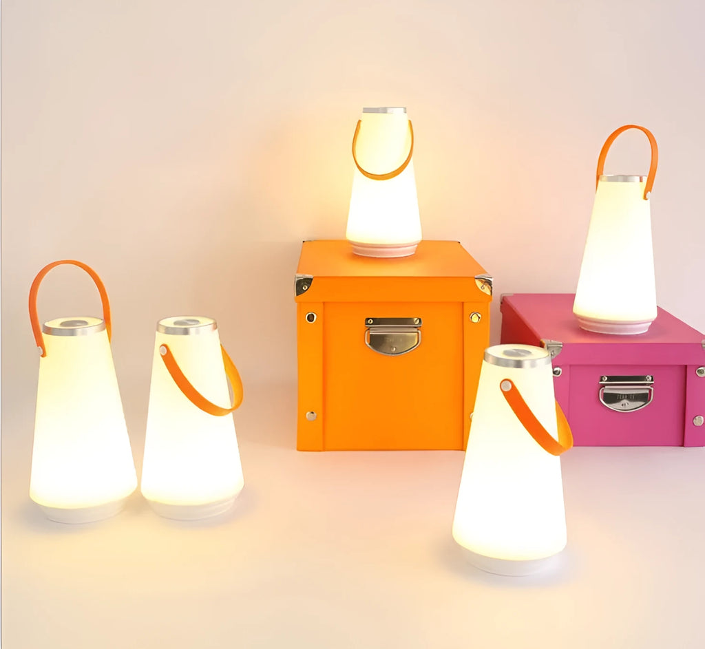 White rechargeable LED bedside lamp with square base measuring 12cm, showing warm white illumination from six LED beads